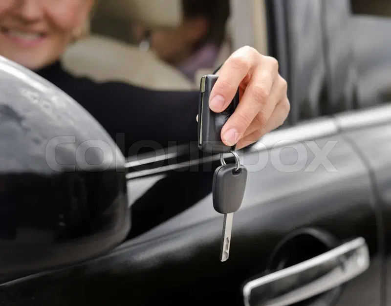 driver in a car with keys 