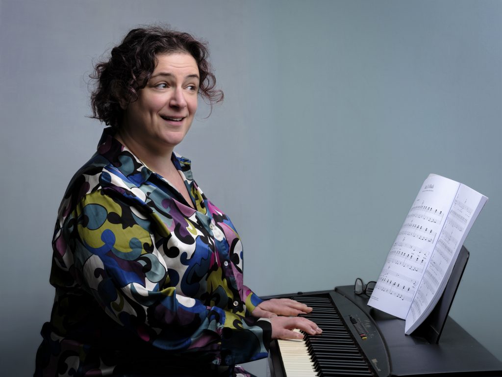 trust singing teacher at piano