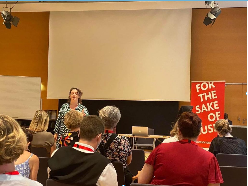 rebecca presenting at an international voice workshop